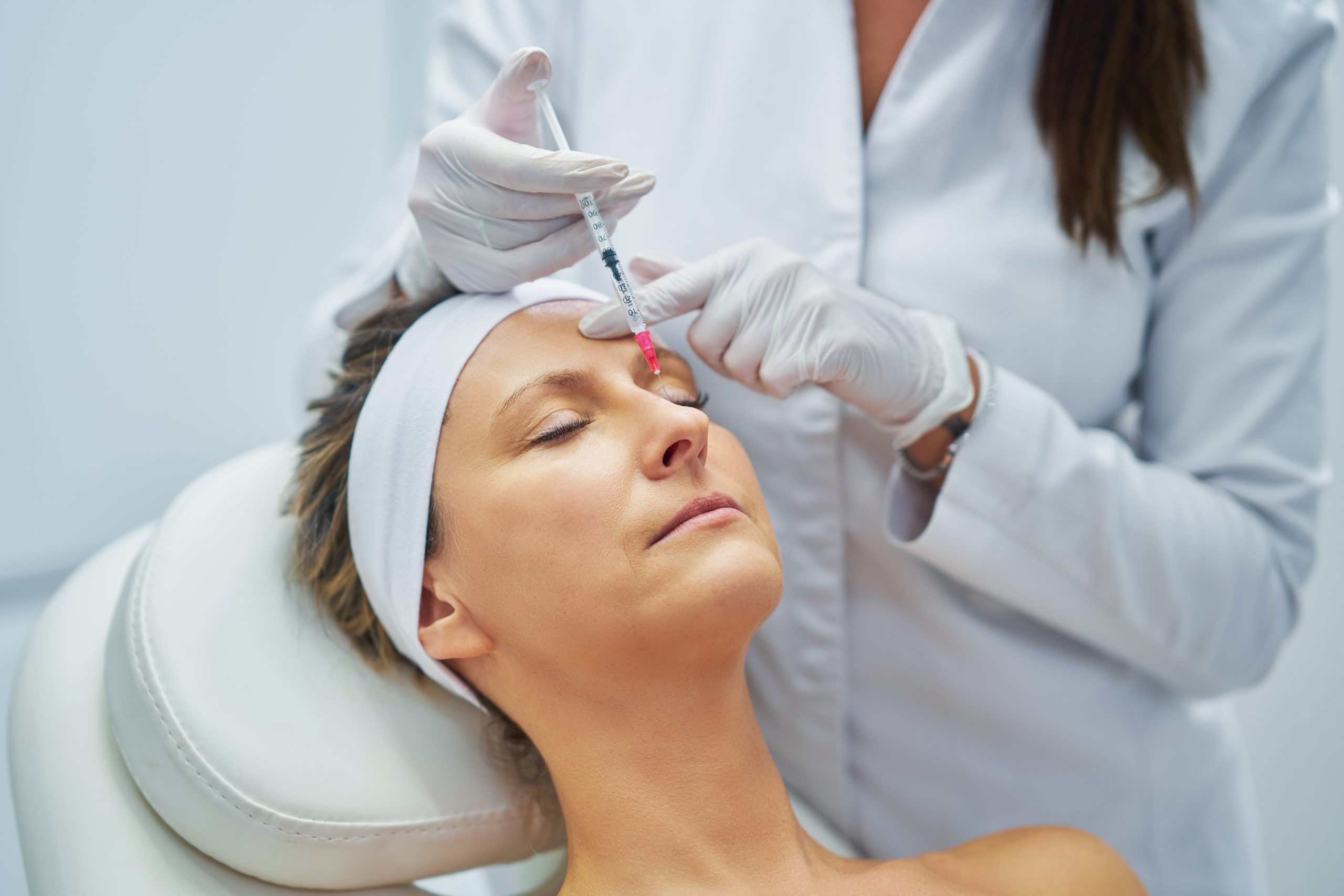 A woman in her fifties getting anti-wrinkle injections at Dr Ifrah's clinic