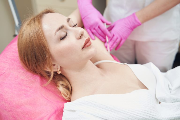 fair skin girl having hyperhidrosis treatment
